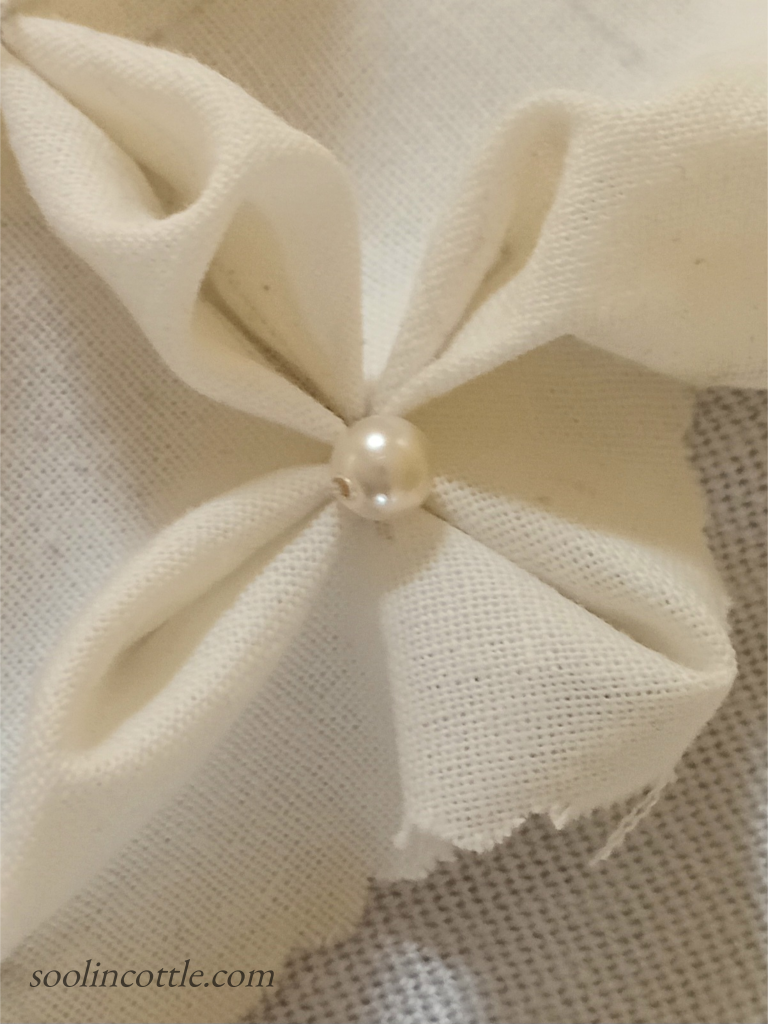 detail of a cotton sample of Canadian smocking - flower pattern